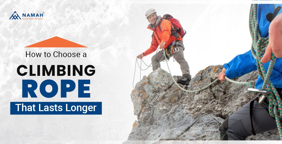 A Man Is Standing On A Rock With The Help Of The Best Climbing Ropes