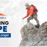 A man is standing on a rock with the help of the best climbing ropes