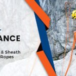Climber using cut resistant ropes with advanced sheath technology for safety on rocky terrain