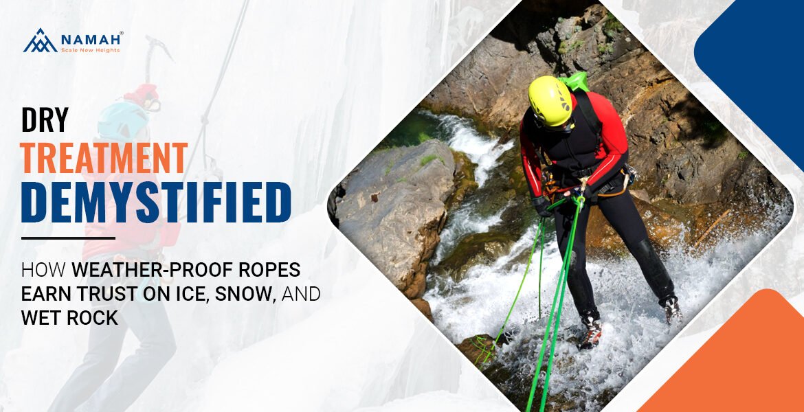 A Man Is Standing On A Icy, Snow Rock With The Help Of Dry Treated Climbing Rope
