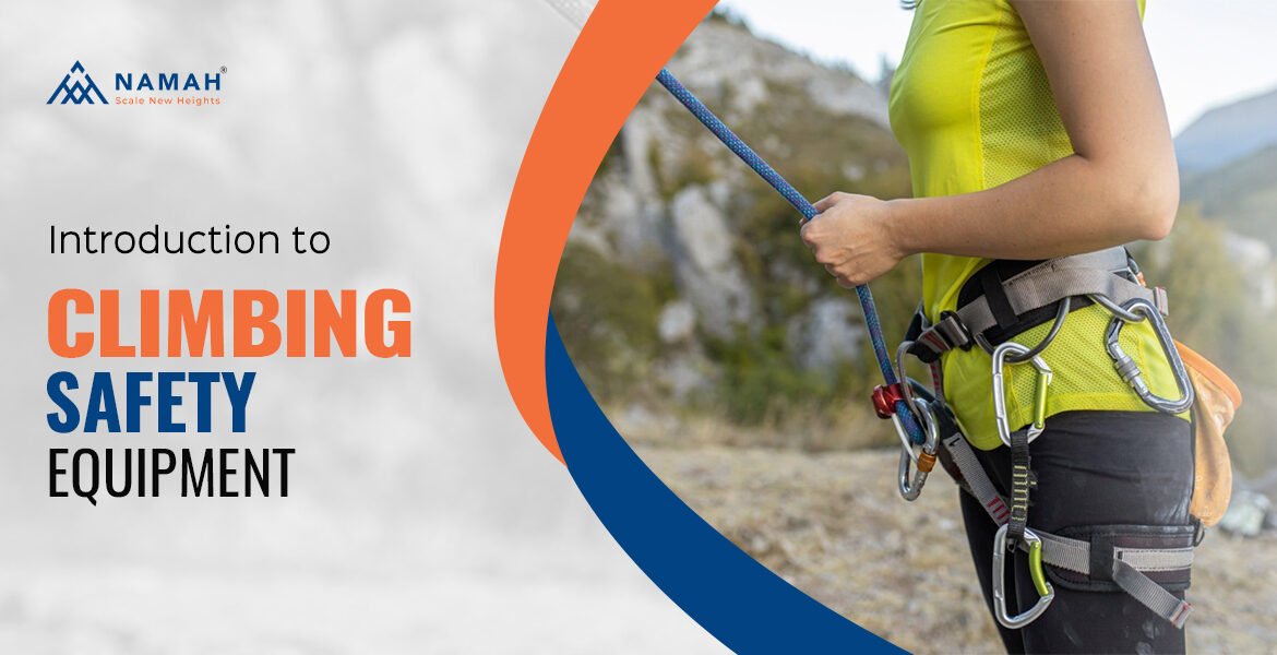 A Girl Is Tightly Holding The Rope Climbing Gear While Climbing On A Rock