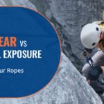 A man is climbing on a rock with Rope Edge Wear