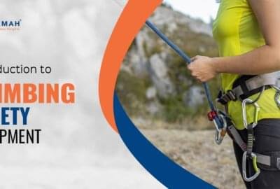 A Girl Is Tightly Holding The Rope Climbing Gear While Climbing On A Rock