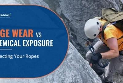 A Man Is Climbing On A Rock With Rope Edge Wear